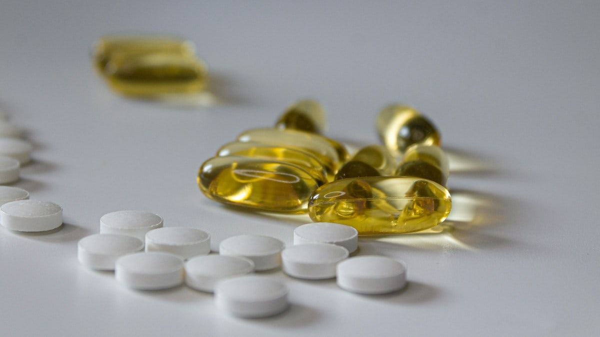 a close up of many pills on a table